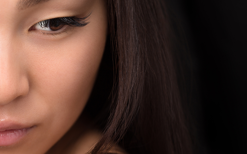 A stock photo of a model with enhanced natural lashes.