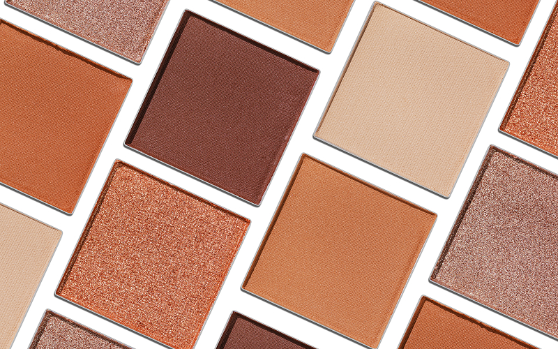 A stock photo of swatches of multiple palette shades on different skin tones.
