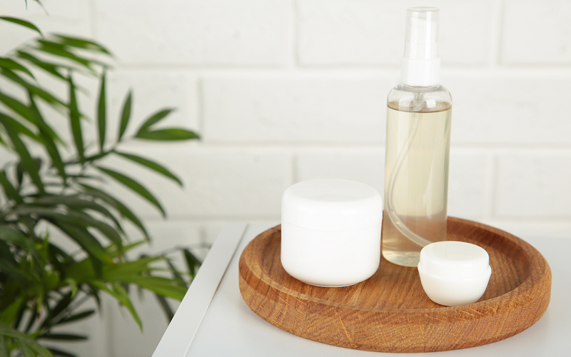 Layered toner, essence and moisturiser routine on a bathroom counter