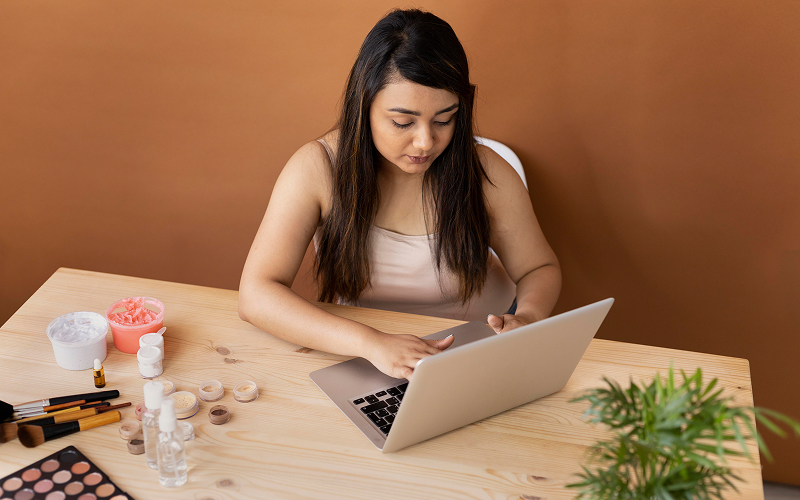 person comparing facial spa options on a laptop