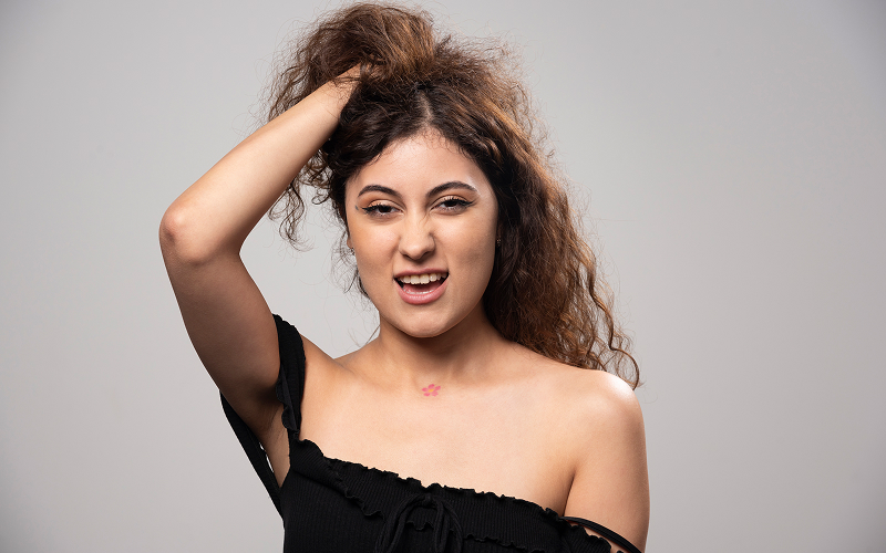 A woman with frizzy hair