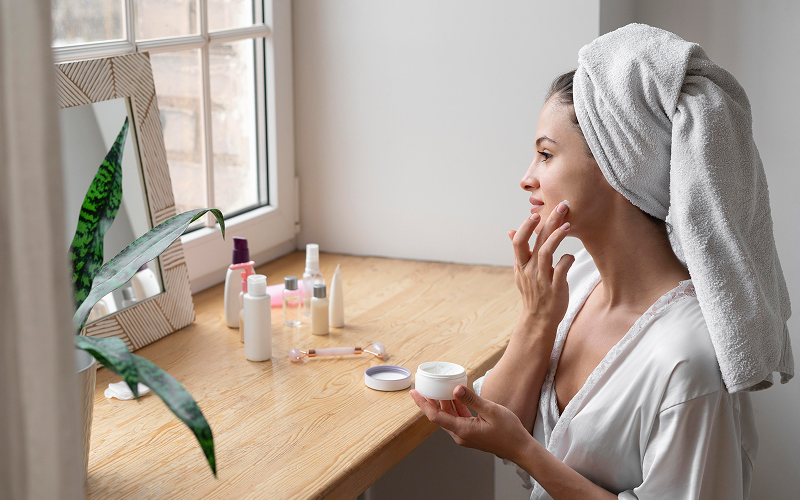 Image of a person doing a morning skincare routine