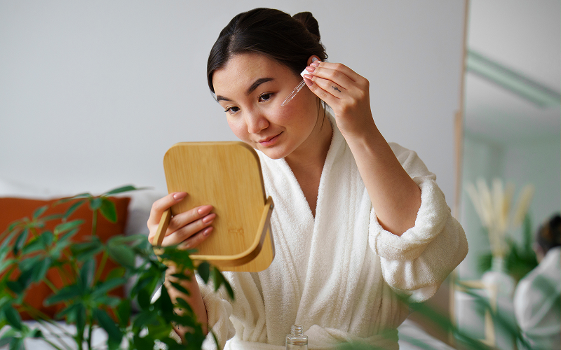 Image of a person using a hydrating serum